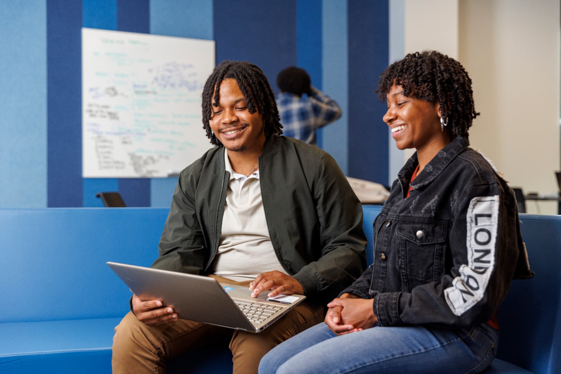 Two Bowie State students collaborating on a laptop